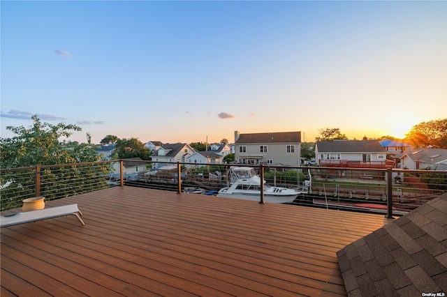 wooden deck featuring a residential view