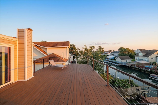 deck at dusk with a residential view