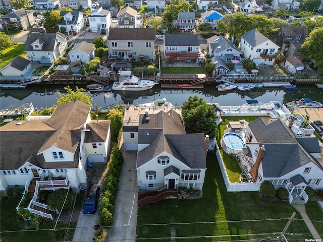 aerial perspective of suburban area featuring a large body of water