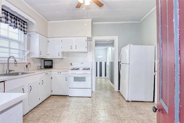 kitchen with white appliances, a sink, crown molding, a ceiling fan, and light countertops