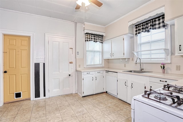 kitchen with a sink, white appliances, crown molding, white cabinets, and light countertops