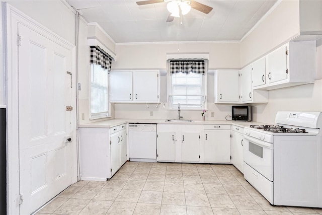 kitchen with white appliances, a ceiling fan, a sink, ornamental molding, and light countertops