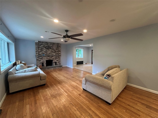 1433 Rte 208, Washingtonville, NY 10992 - living room featuring light wood-style floors, baseboards, a brick fireplace, ceiling fan, and recessed lighting
