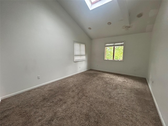 1433 Rte 208, Washingtonville, NY 10992 - unfurnished room featuring a skylight, carpet floors, baseboards, and high vaulted ceiling