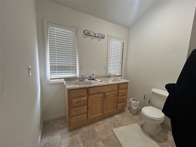 1433 Rte 208, Washingtonville, NY 10992 - full bath featuring toilet, lofted ceiling, double vanity, and baseboards