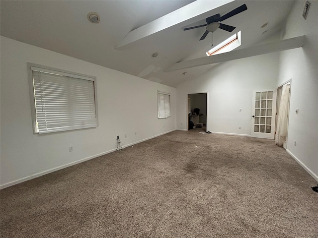 1433 Rte 208, Washingtonville, NY 10992 - unfurnished living room featuring ceiling fan, a skylight, carpet floors, high vaulted ceiling, and baseboards