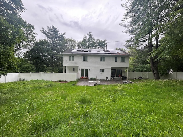 1433 Rte 208, Washingtonville, NY 10992 - rear view of property featuring a patio, solar panels, and a fenced backyard