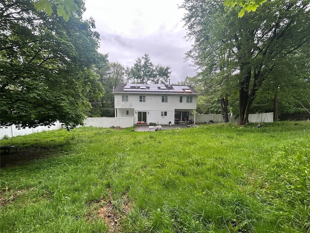 1433 Rte 208, Washingtonville, NY 10992 - rear view of property featuring solar panels, a fenced backyard, and a patio