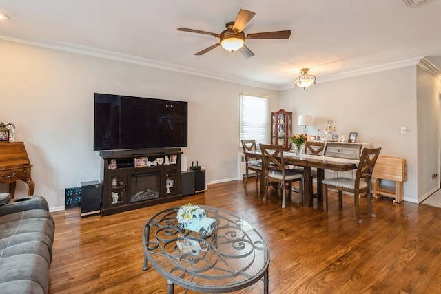 75 Massachusetts Ave, Massapequa, NY 11758 - living room featuring ornamental molding, ceiling fan, wood finished floors, and baseboards