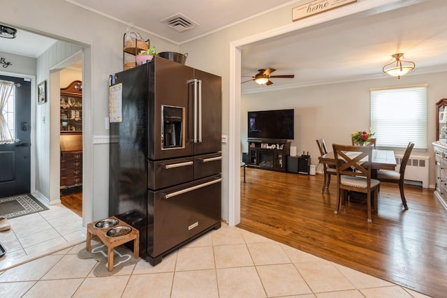 75 Massachusetts Ave, Massapequa, NY 11758 - kitchen featuring high quality fridge, ornamental molding, plenty of natural light, and light tile patterned floors