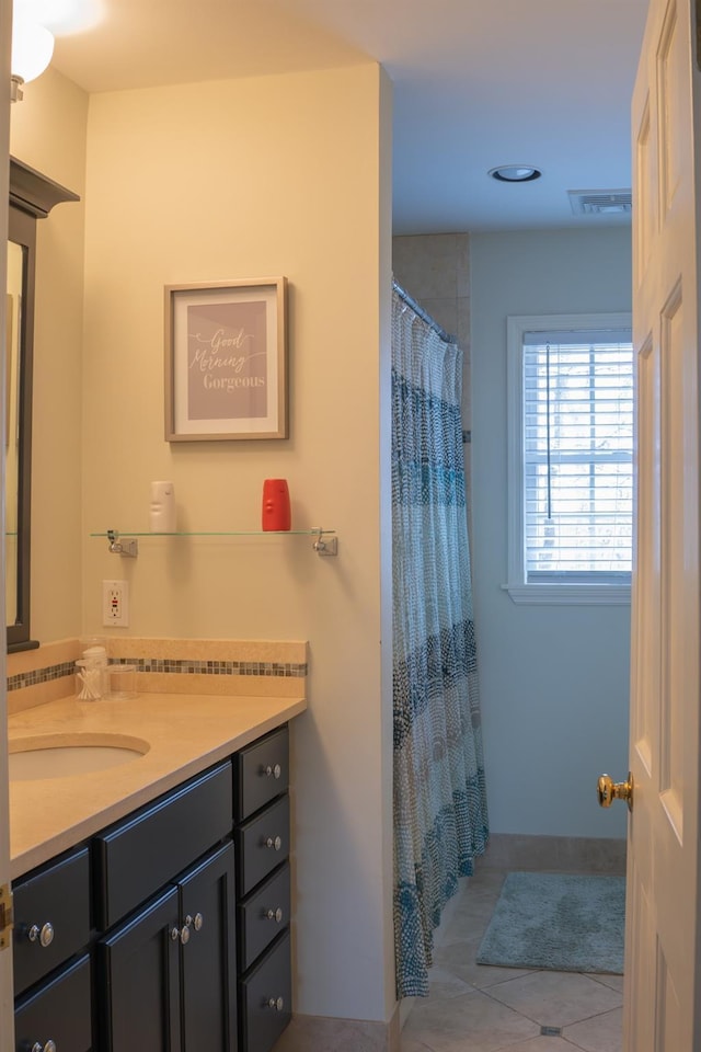 full bathroom featuring tile patterned floors, vanity, and a shower with shower curtain
