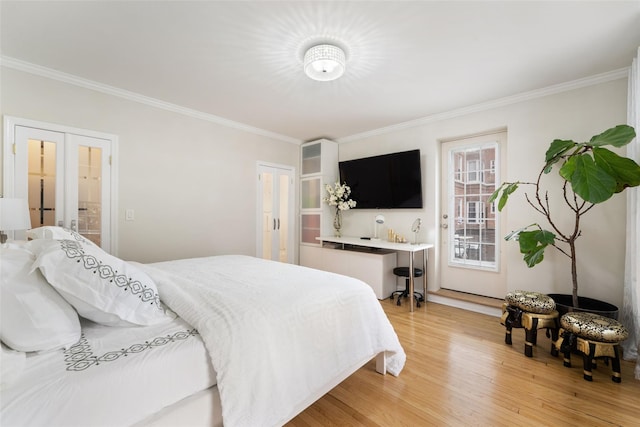 bedroom with crown molding, french doors, and light wood-type flooring