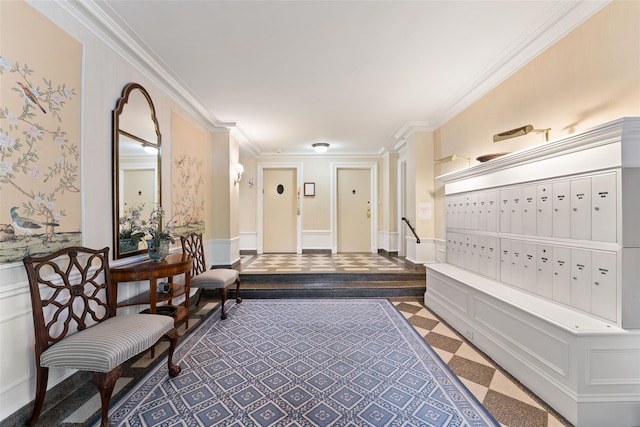 community lobby featuring wainscoting, ornamental molding, and a decorative wall