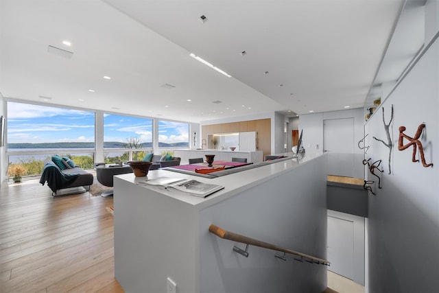 26 Mount Green Rd, Croton-On-Hudson, NY 10520 - kitchen with a wall of windows, light wood-style floors, a water view, and recessed lighting