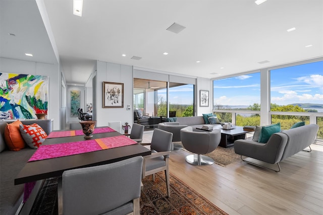 26 Mount Green Rd, Croton-On-Hudson, NY 10520 - dining area featuring light wood-style floors and a wall of windows