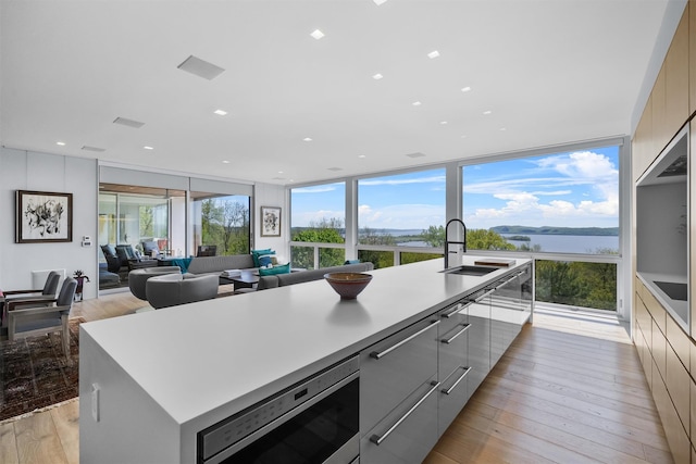 26 Mount Green Rd, Croton-On-Hudson, NY 10520 - kitchen with a sink, modern cabinets, stainless steel microwave, gray cabinets, and recessed lighting