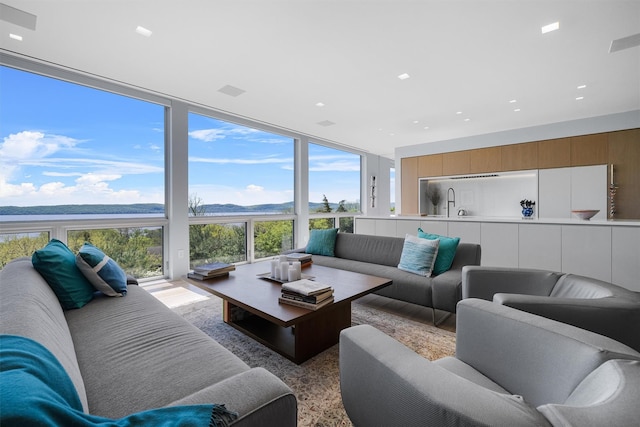 26 Mount Green Rd, Croton-On-Hudson, NY 10520 - living area featuring a water view, plenty of natural light, and floor to ceiling windows