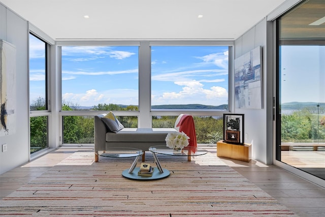 26 Mount Green Rd, Croton-On-Hudson, NY 10520 - living area with wood finished floors, healthy amount of natural light, and floor to ceiling windows