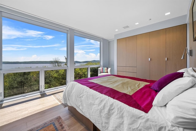 26 Mount Green Rd, Croton-On-Hudson, NY 10520 - bedroom featuring wood finished floors and a water view