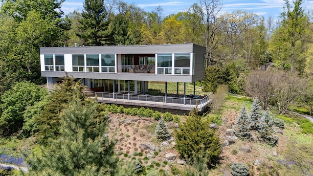 26 Mount Green Rd, Croton-On-Hudson, NY 10520 - rear view of property featuring a sunroom and a wooden deck