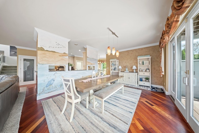 9 Fairwind Ct, Oakdale, NY 11769 - dining space with a chandelier, wood finished floors, and crown molding