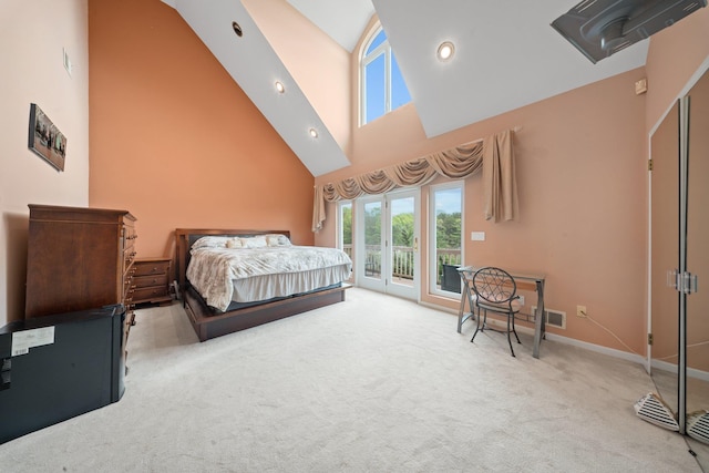 9 Fairwind Ct, Oakdale, NY 11769 - bedroom featuring high vaulted ceiling, access to exterior, carpet, and baseboards