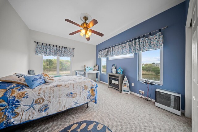 9 Fairwind Ct, Oakdale, NY 11769 - bedroom featuring carpet floors, baseboards, heating unit, and a ceiling fan