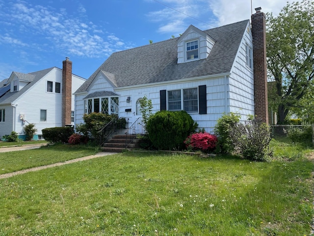 7927 270th St, New Hyde Park, NY 11040 - cape cod home featuring a chimney and a shingled roof