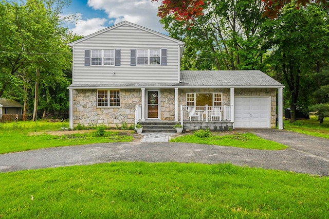 8 Mill Lot Rd, Middle Island, NY 11953 - traditional-style home with stone siding, a porch, driveway, and a garage