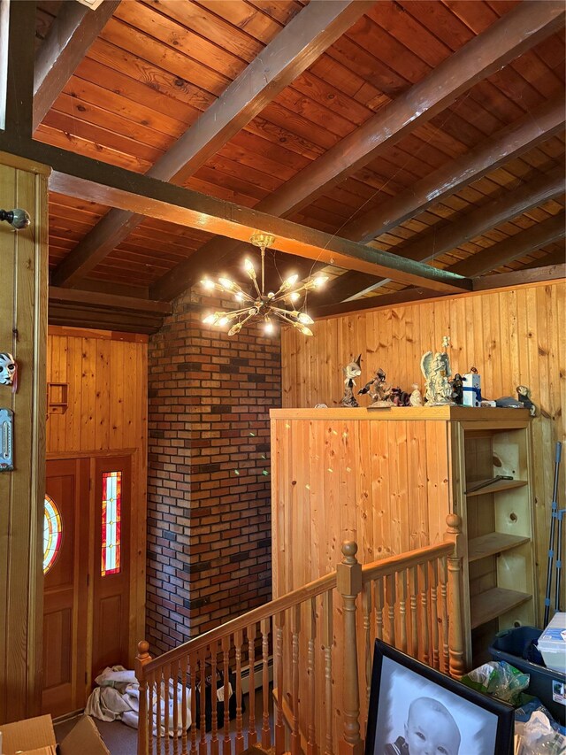 6 Annette Ln, East Moriches, NY 11940 - misc room with an upstairs landing, wood ceiling, beamed ceiling, a chandelier, and wooden walls