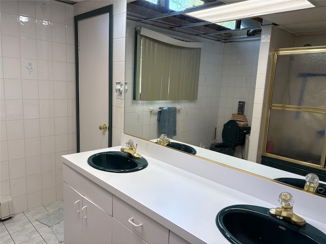 6 Annette Ln, East Moriches, NY 11940 - full bath featuring tile walls, an enclosed shower, and double vanity