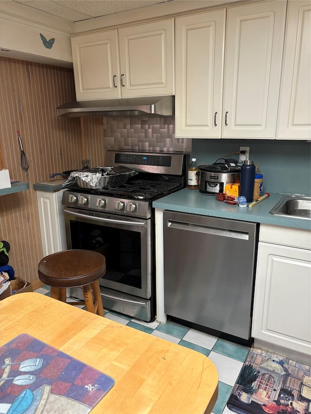 6 Annette Ln, East Moriches, NY 11940 - kitchen featuring stainless steel appliances, white cabinets, and light floors