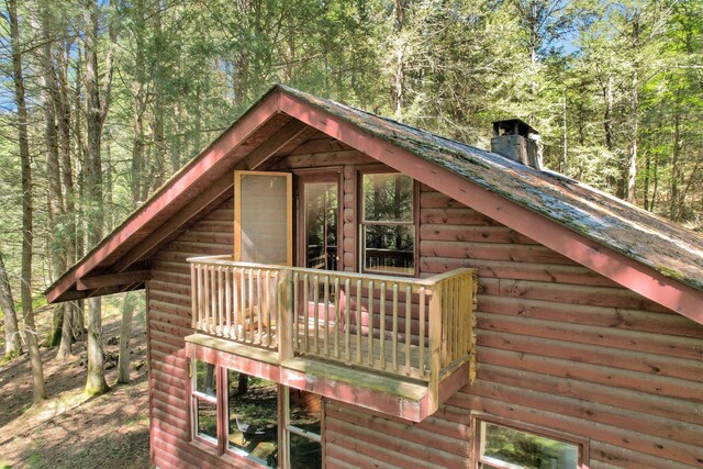 60 Park Road Ext, Eldred, NY 12792 - view of side of property with a chimney and a wooded view