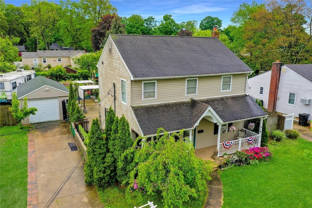 24 Haynes Ave, West Islip, NY 11795 - view of front of property featuring covered porch, a detached garage, a chimney, roof with shingles, and a front yard