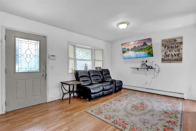24 Haynes Ave, West Islip, NY 11795 - living room featuring a baseboard radiator and wood finished floors