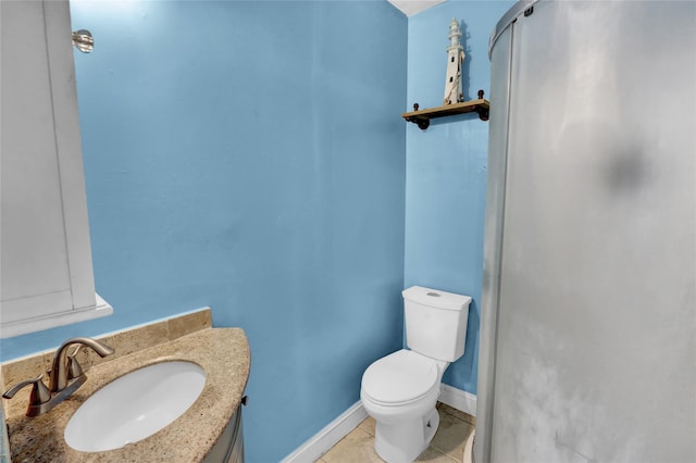 24 Haynes Ave, West Islip, NY 11795 - bathroom with toilet, vanity, tile patterned floors, and baseboards
