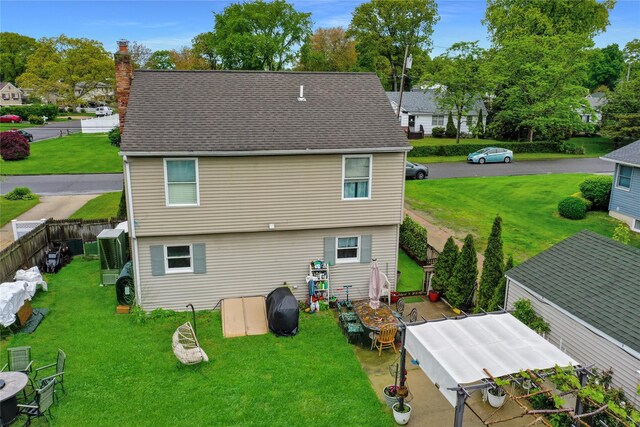 24 Haynes Ave, West Islip, NY 11795 - back of property with a chimney