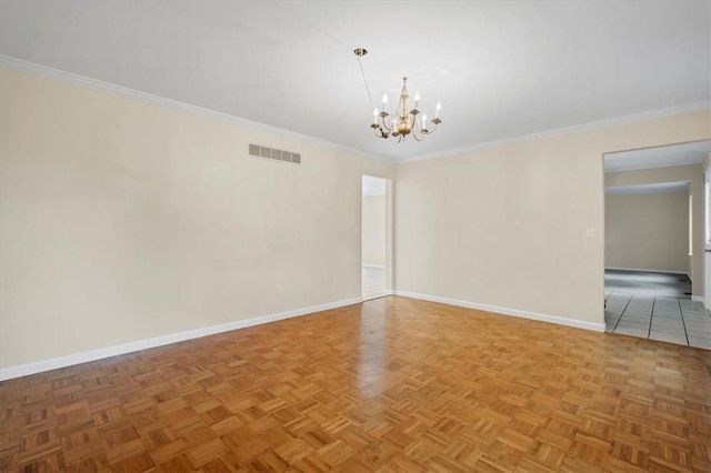 unfurnished room with a chandelier, baseboards, and ornamental molding