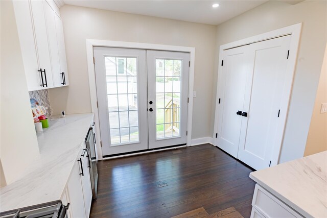 entryway featuring french doors, dark wood-style flooring, and recessed lighting