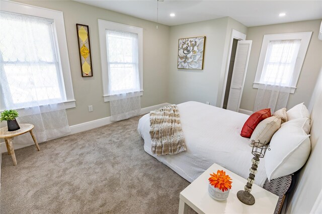 bedroom featuring carpet, recessed lighting, and baseboards