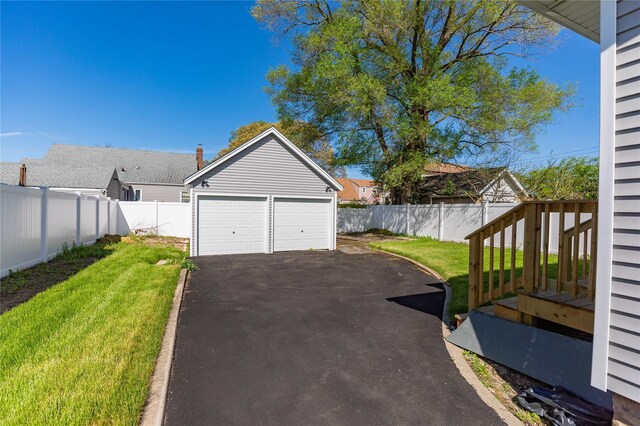 garage featuring driveway