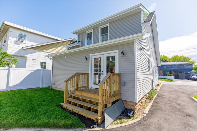 back of house featuring french doors