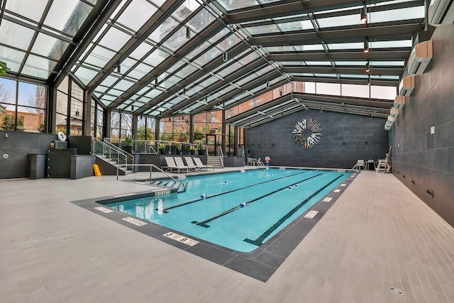 4 Martine Ave Unit 712, White Plains, NY 10606 - indoor community pool with a wall mounted AC and a patio area