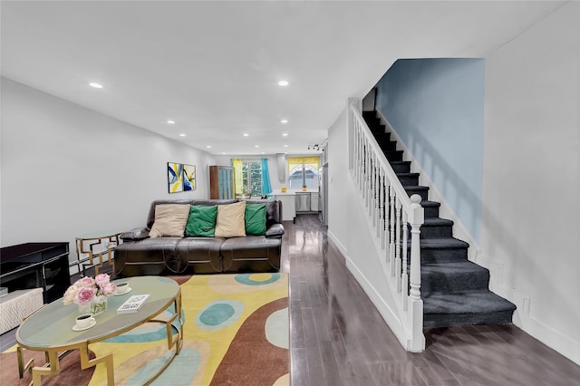 living room featuring stairway, recessed lighting, dark wood-style floors, and baseboards