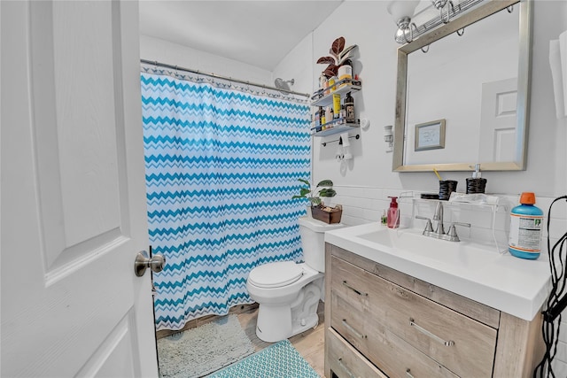 full bathroom with toilet, vanity, a shower with curtain, and wood finished floors