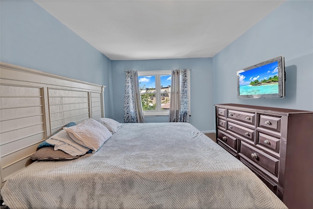 bedroom with carpet and baseboards
