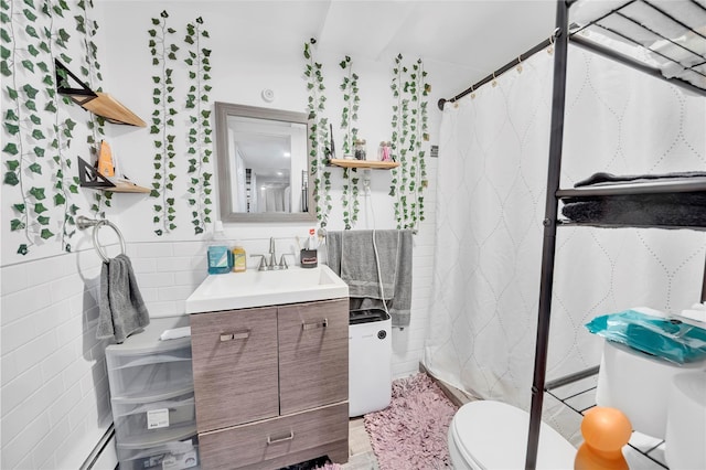 full bath with toilet, tile walls, vanity, and a shower with shower curtain