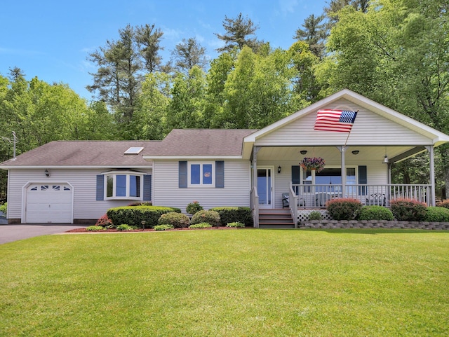 229 Eldred Yulan Rd, Eldred, NY 12792 - view of front of property featuring an attached garage, a porch, a front yard, driveway, and roof with shingles
