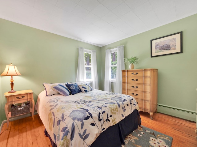 229 Eldred Yulan Rd, Eldred, NY 12792 - bedroom with a baseboard radiator and hardwood / wood-style floors