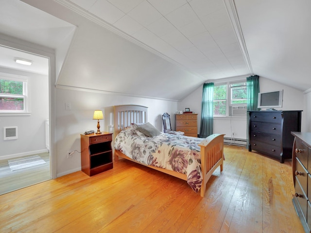 229 Eldred Yulan Rd, Eldred, NY 12792 - bedroom featuring light wood-type flooring, lofted ceiling, baseboard heating, and baseboards